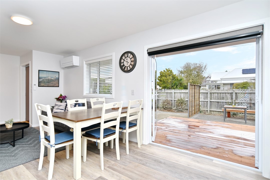 Dining area seats 5 people and outdoor area