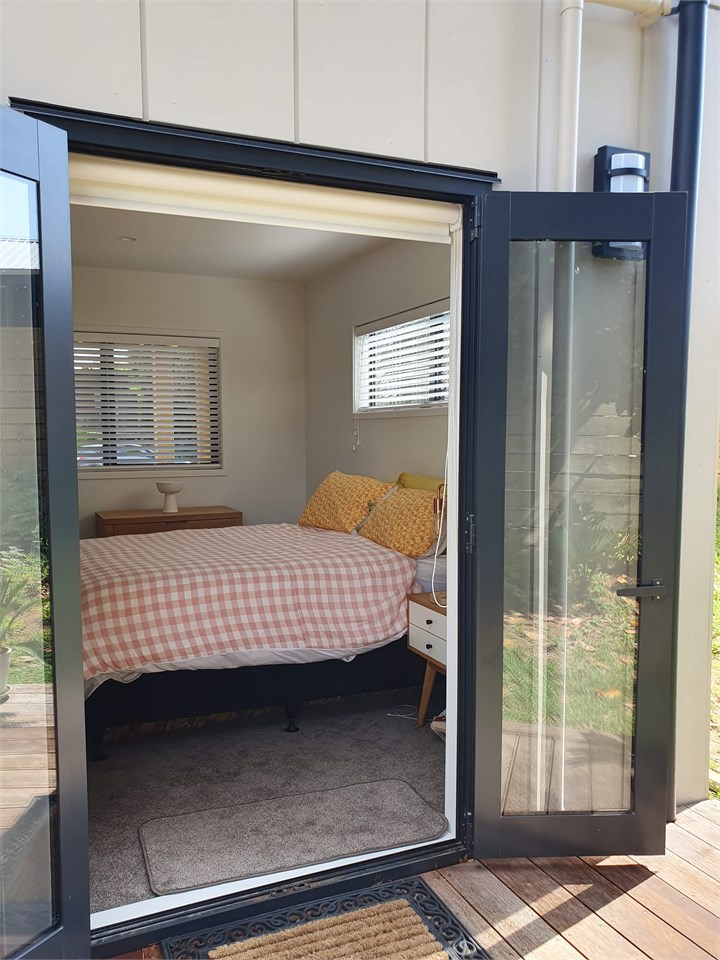 Downstairs bedroom, opens onto back yard.