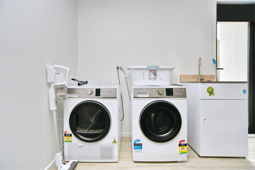 Laundry area has a washing machine and a dryer