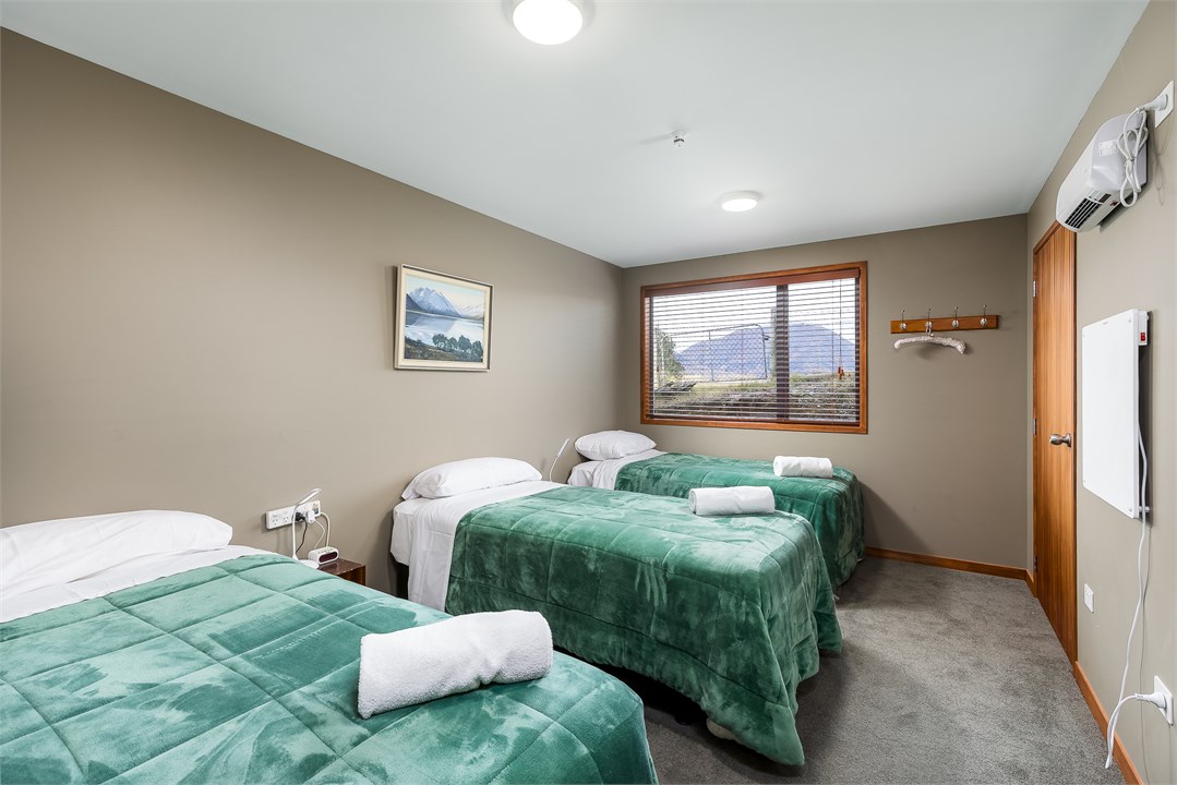 Downstairs bedroom - three singles