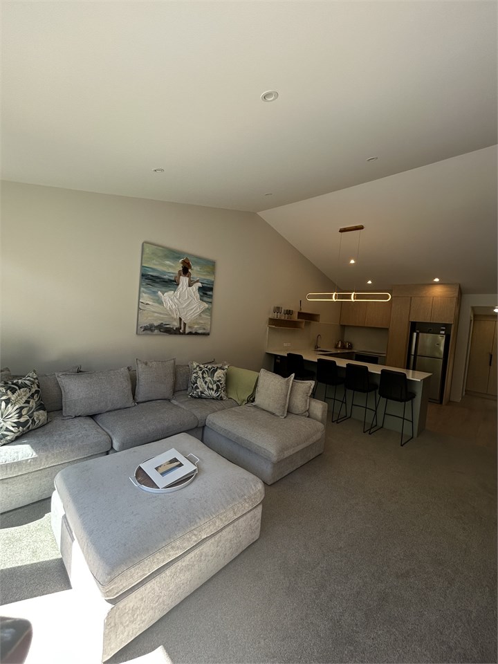 Lounge and open plain kitchen