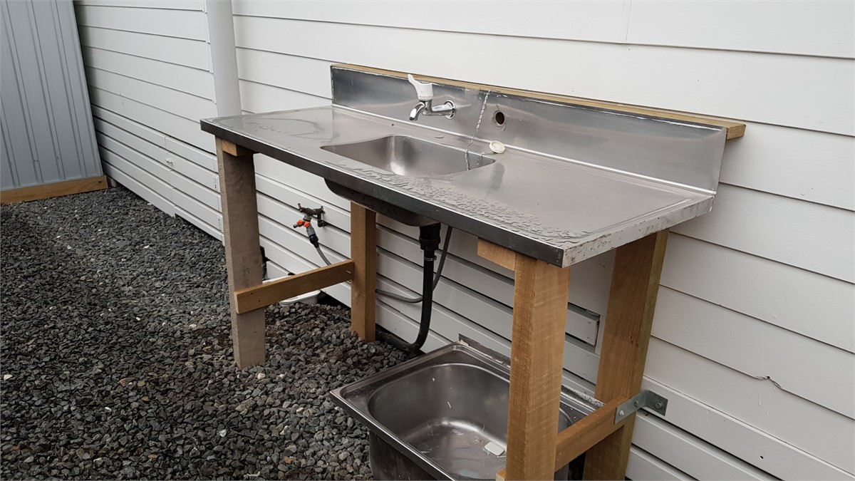 Fish cleaning area behind cottage