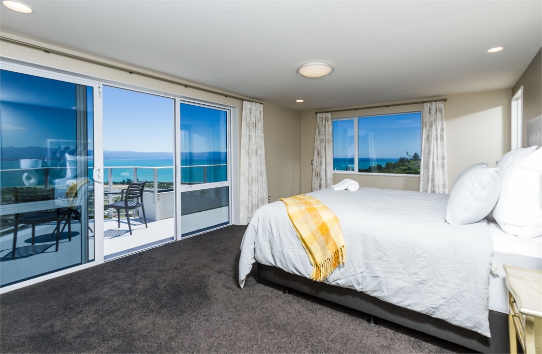 Upstairs Master bedroom with King bed, balcony