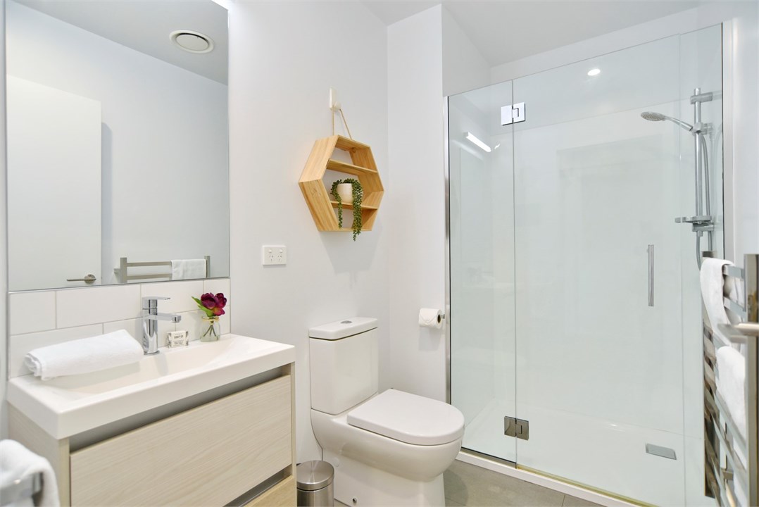 Bathroom 1 has a shower and a toilet