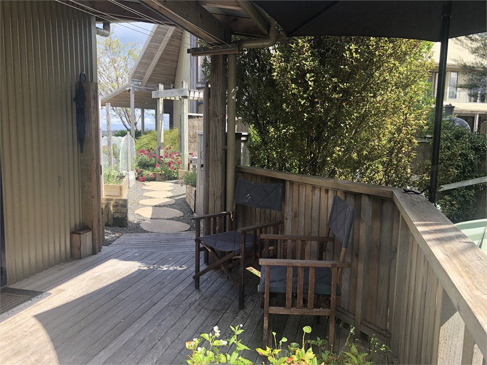 Deck towards main house, showing vege garden betwe