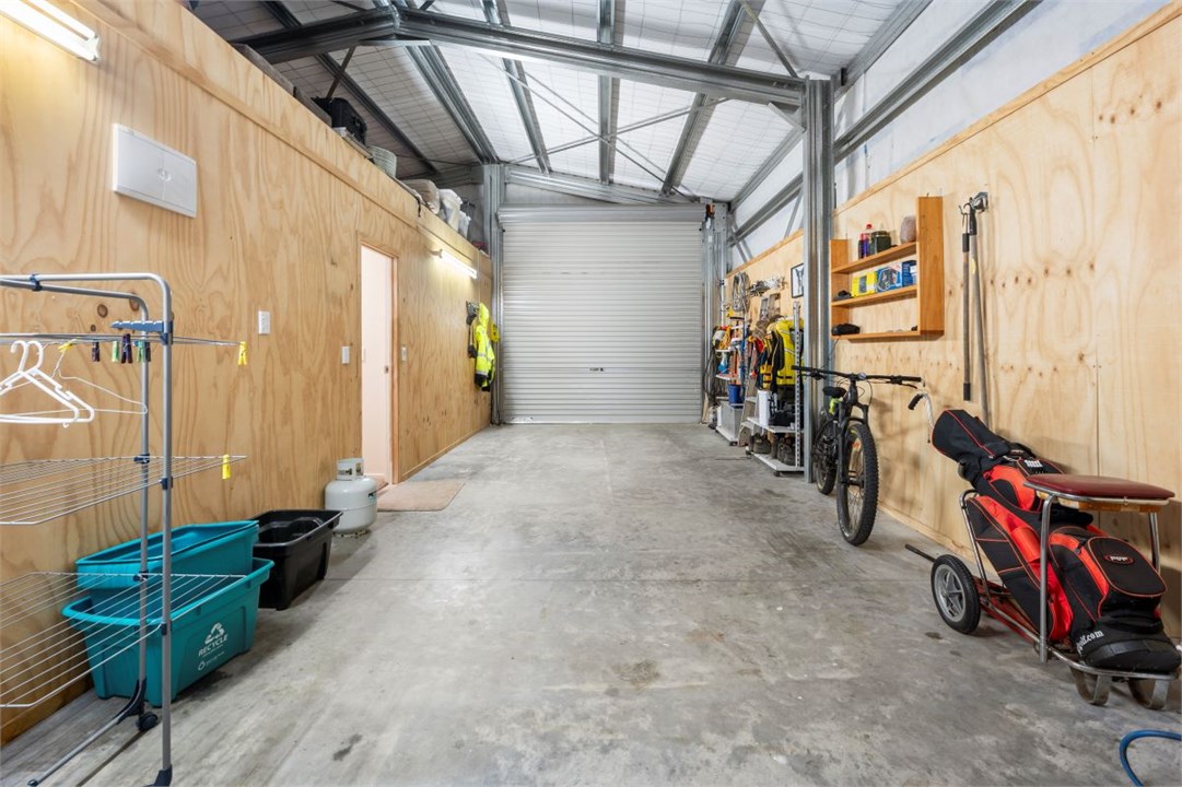 Internal, high stud garage. Can park a boat