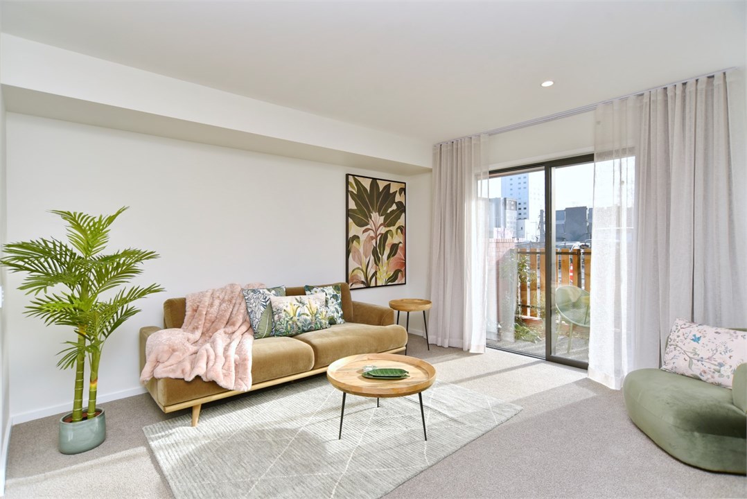 Living room has a TV and seating area