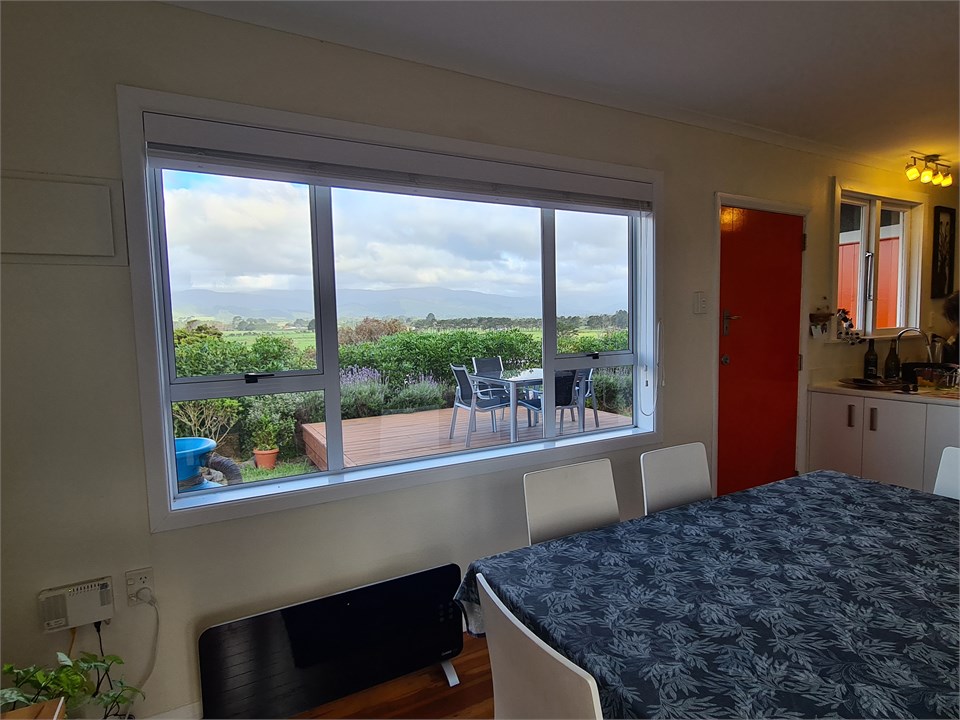 Sunny kitchen and dining room, looking east