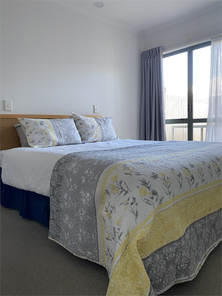 Master bedroom opens to small patio