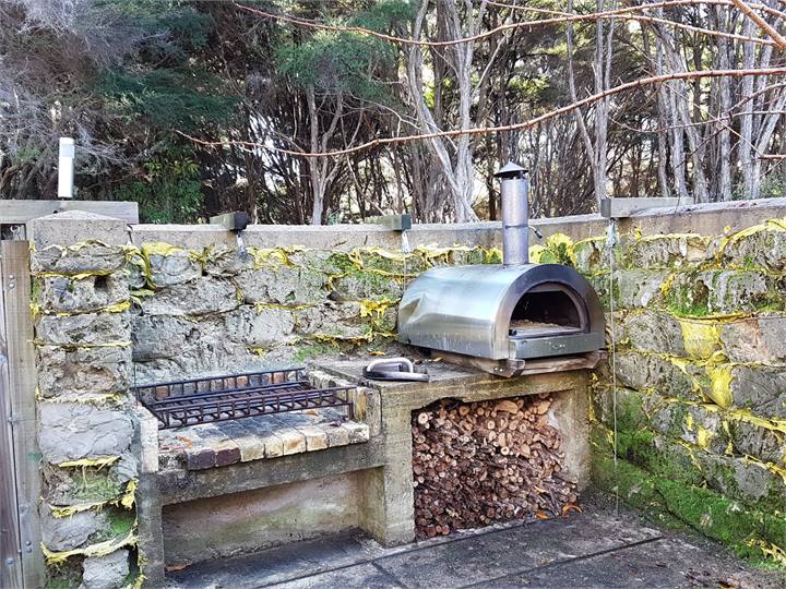 Pizza oven and one of 2 BBqs