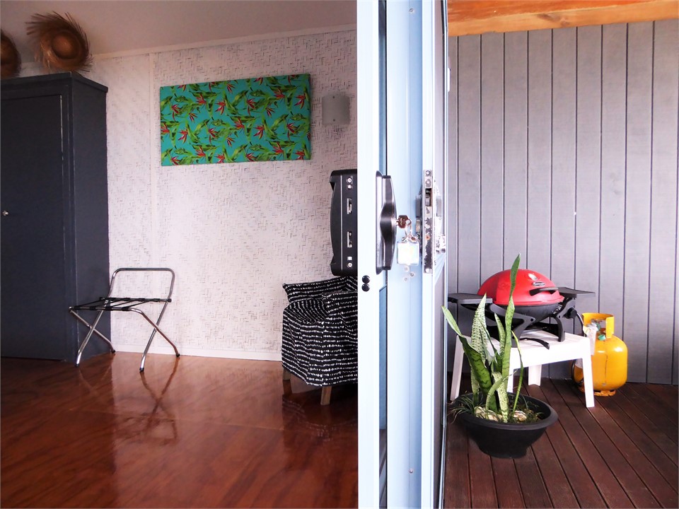 step outside to the deck that looks over the beach