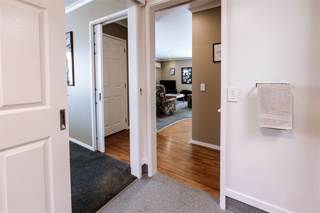 View from bathroom, leading to the main bedroom an
