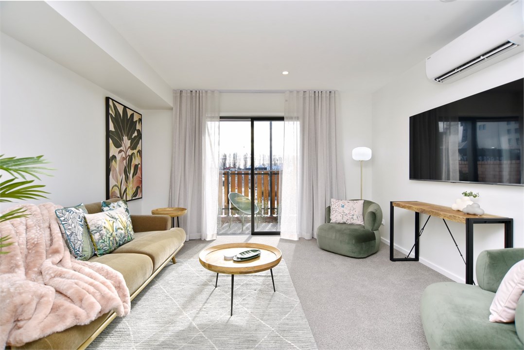 Living room has a TV and seating area