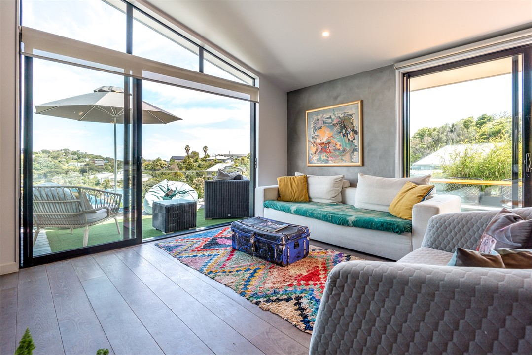 Main living room leading to deck