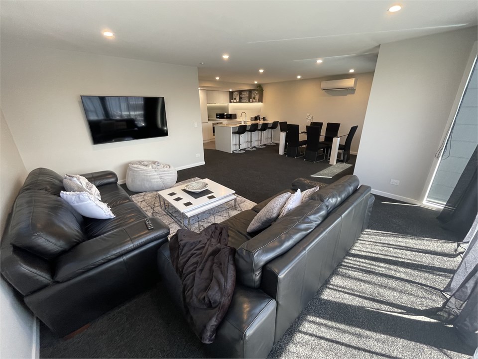 Open plan lounge with kitchen and dining area