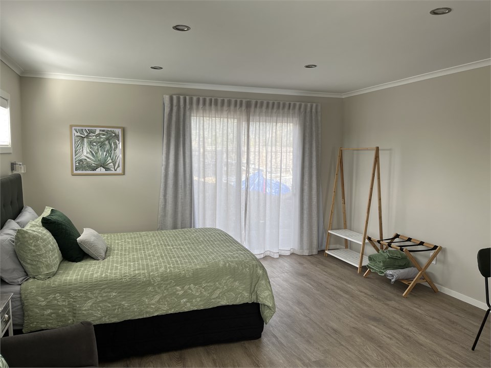 Bedroom area with slider to private enclosed patio