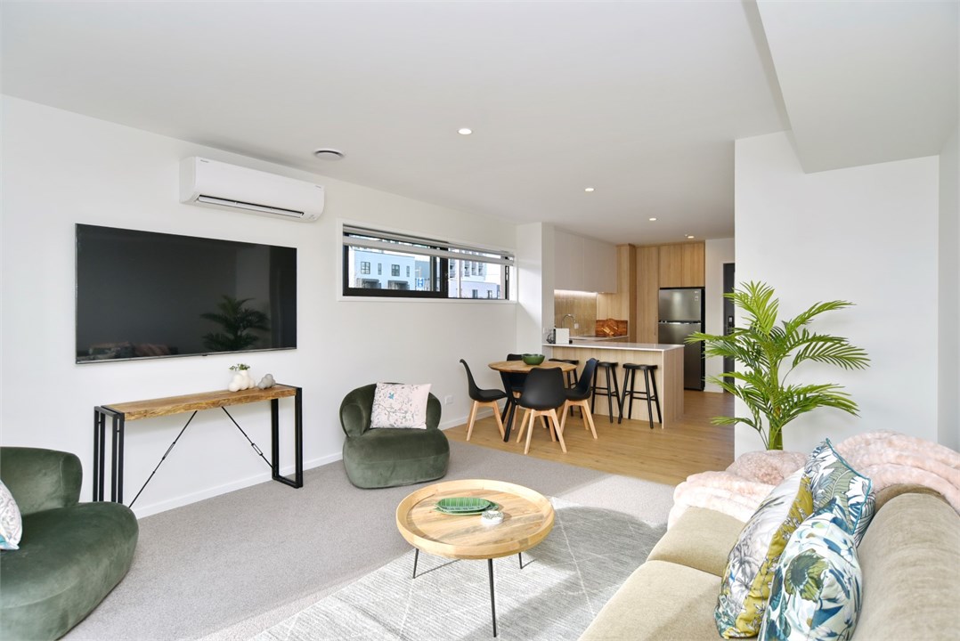 Living room has a TV and seating area