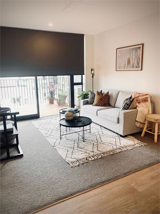 Living room has a TV and seating areas