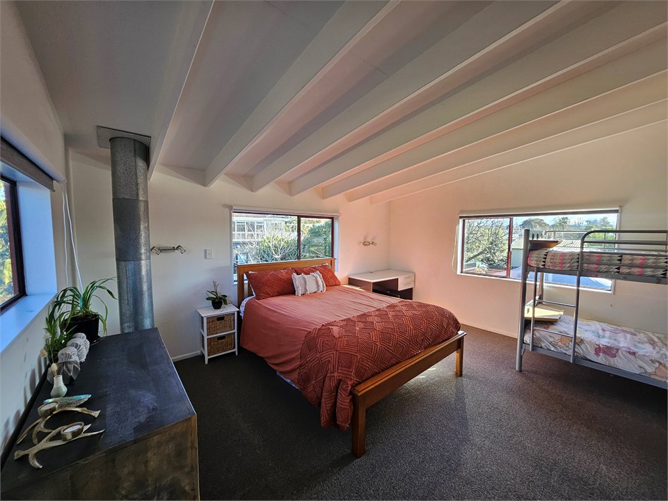 Bedroom upstairs with Queen + bunks