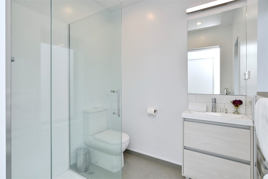 Bathroom 2 has a shower and a toilet