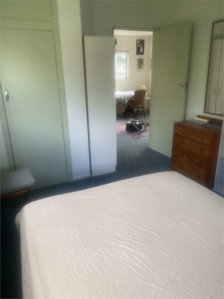 Looking into lounge from double bedroom