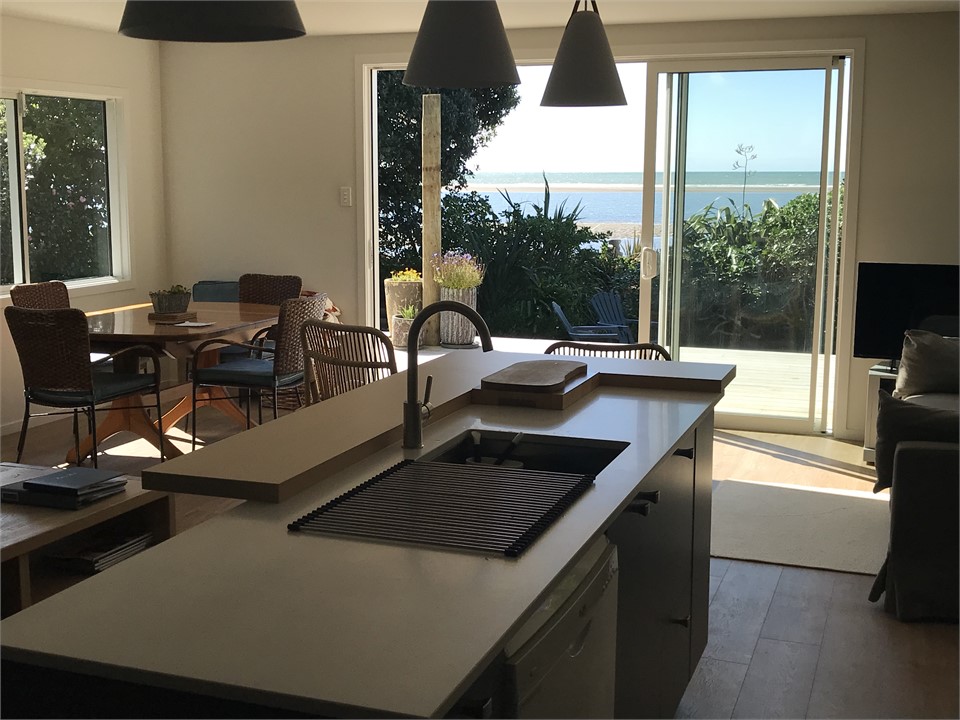 View to deck from kitchen at No 27