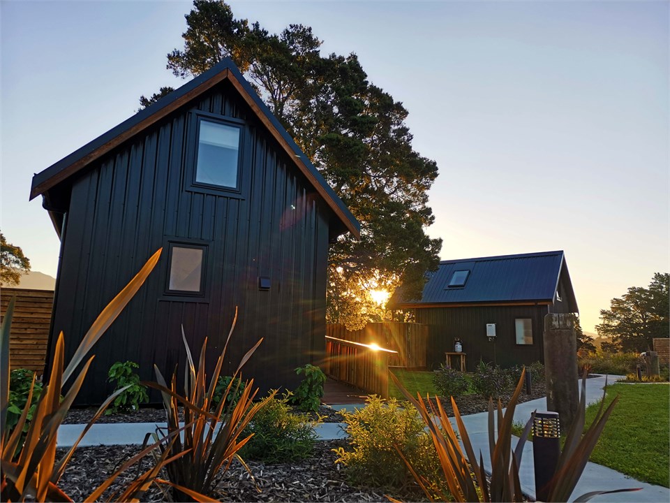 Private deluxe huts set amongst magnificent Totara