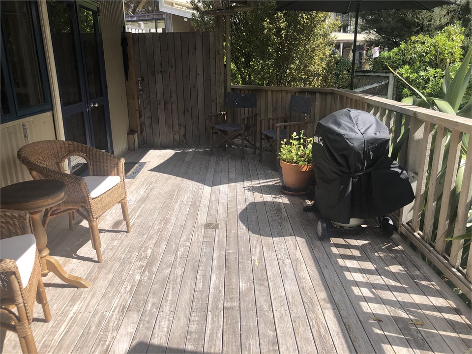 Deck - windows and door of studio,  privacy gate, 