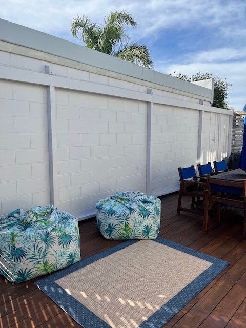 Downstair desk with table and umbrella and 8 chair