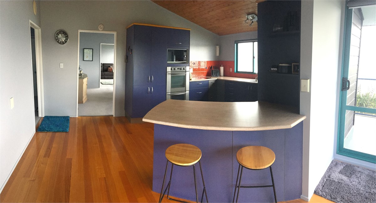 Kitchen looking through to dining and lounge