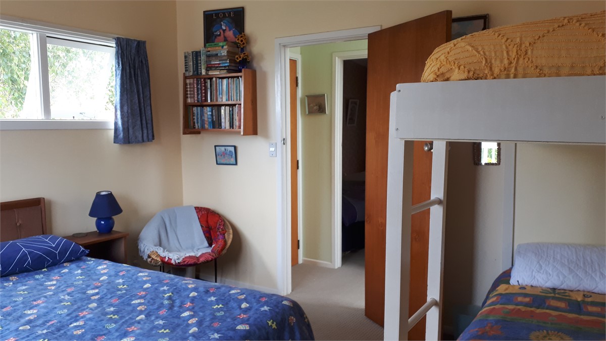 Upstairs bedroom with king size bed and bunks