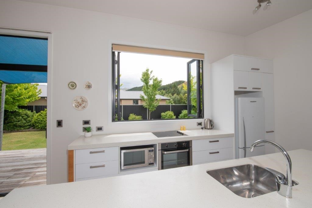 Kitchen looking outside onto the massive deck with