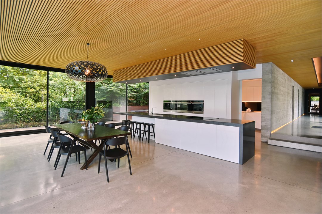 View of the Dining table and the Kitchen