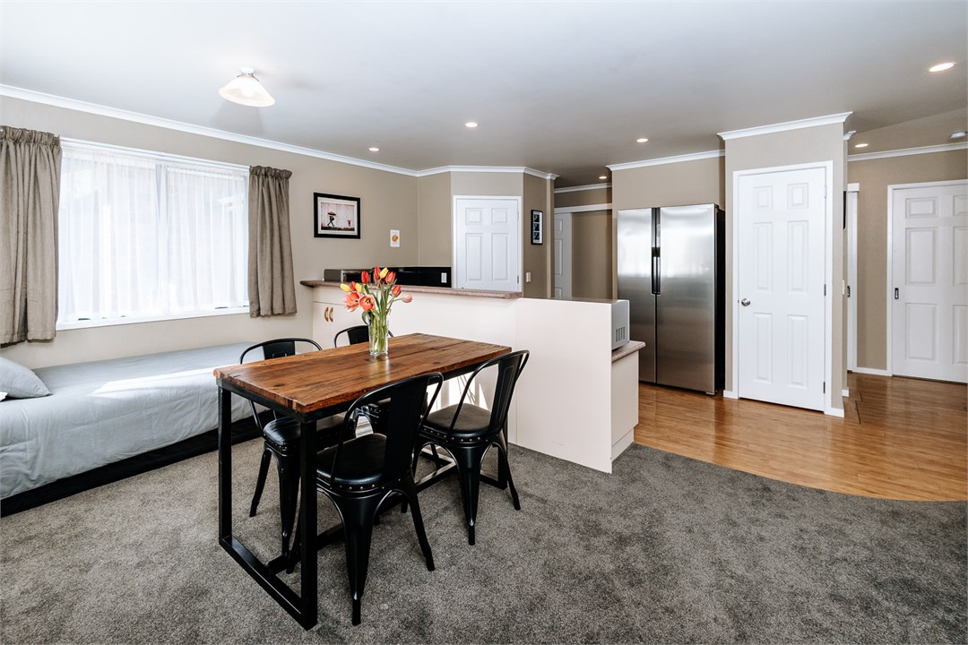 Open-plan dining room area with the 4th bed. Dinin