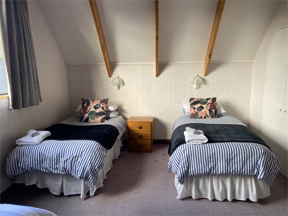 Upstairs 3 single beds room