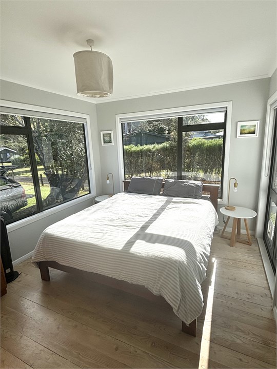 main bedroom in bach (king bed)