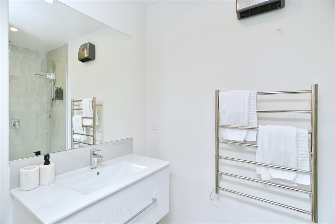 Bathroom 1 has a shower and a toilet