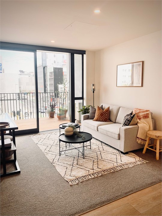 Living room has a TV and seating areas