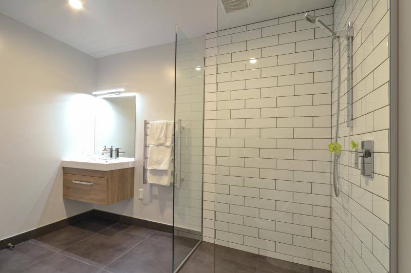 Large  bathroom with shower and toilet