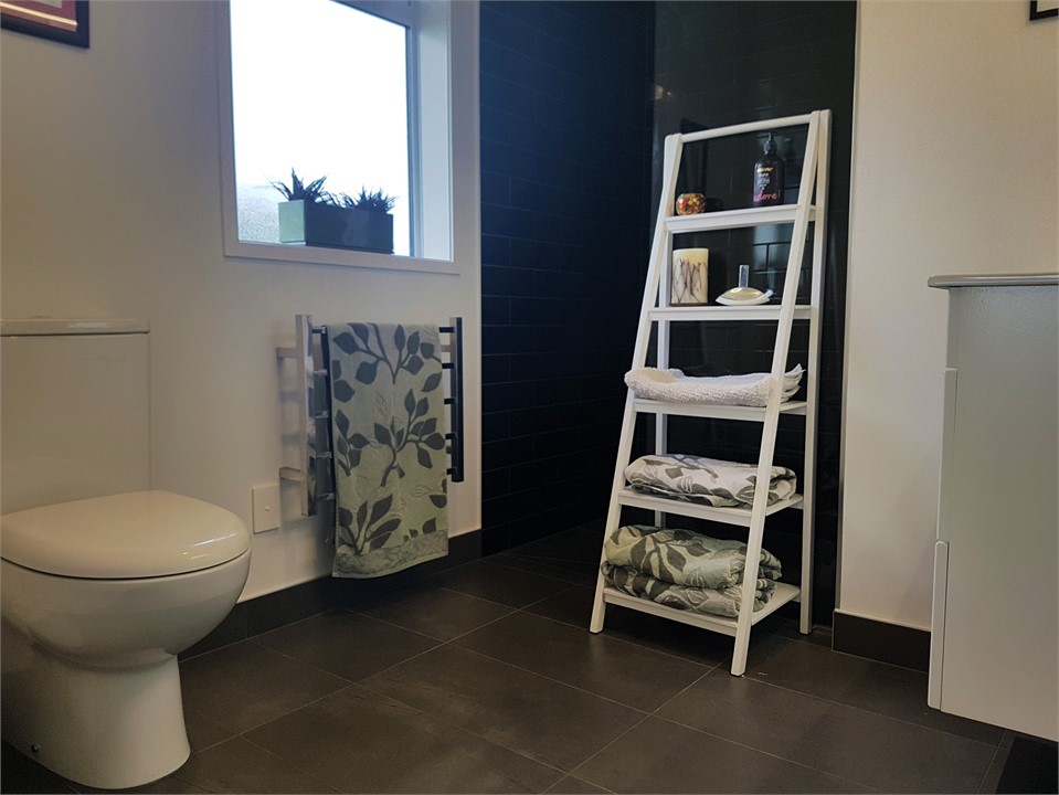 Ensuite bathroom with shower and toilet