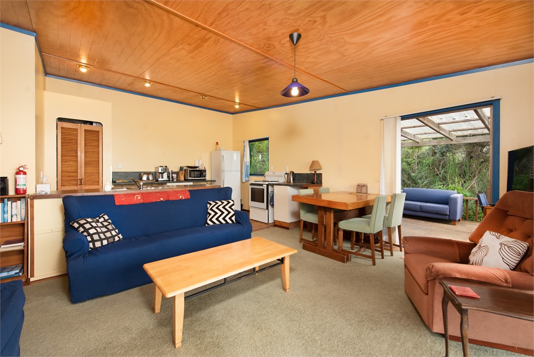 Kitchen at rear. Side door to covered deck