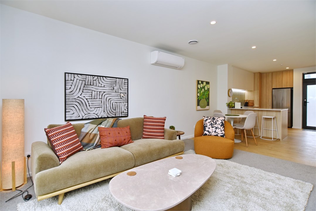 Living room has a TV and seating areas