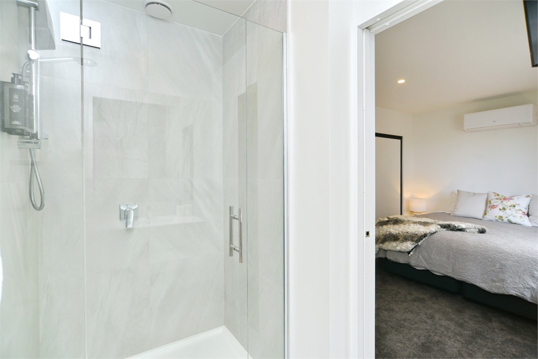 Bathroom 1 has a shower and a toilet