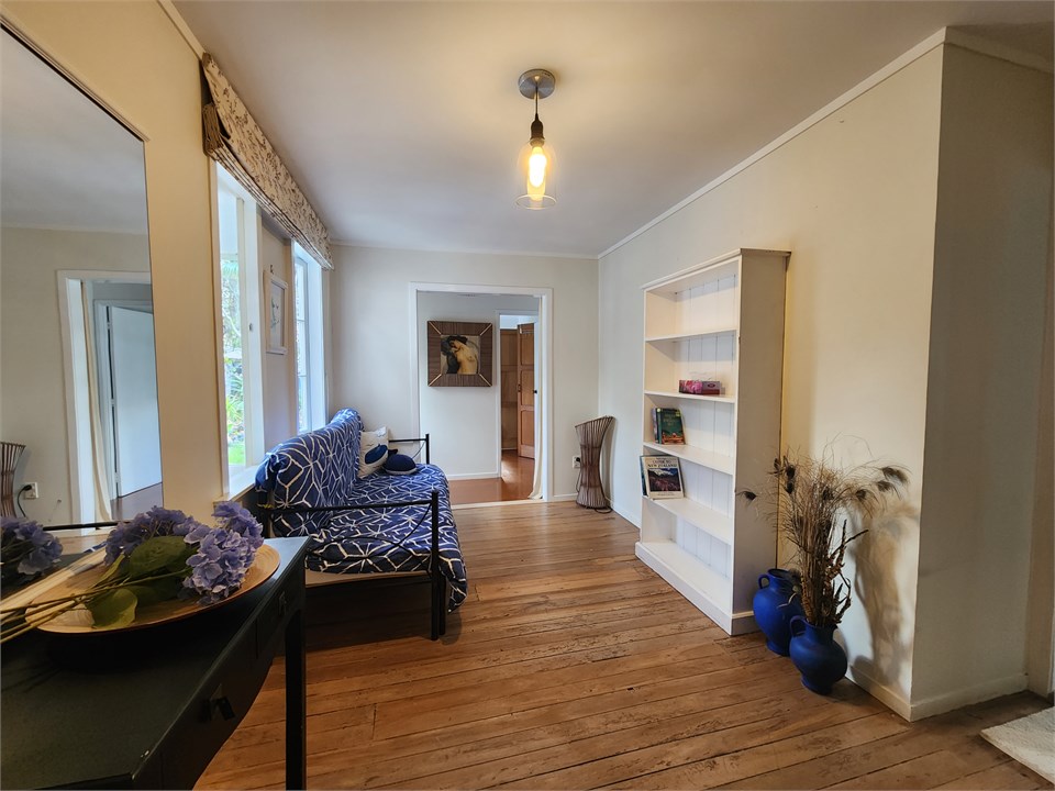 The large passage way has a divan couch/bed