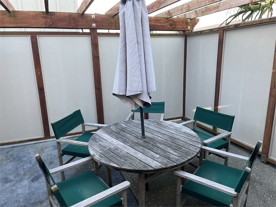 Outdoor dining table in private BBQ patio