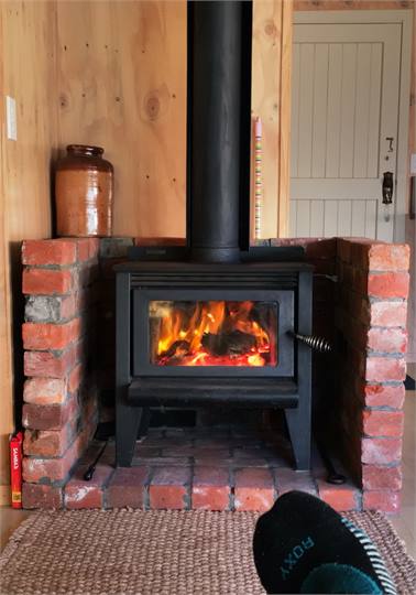 Feet up in front of the fire