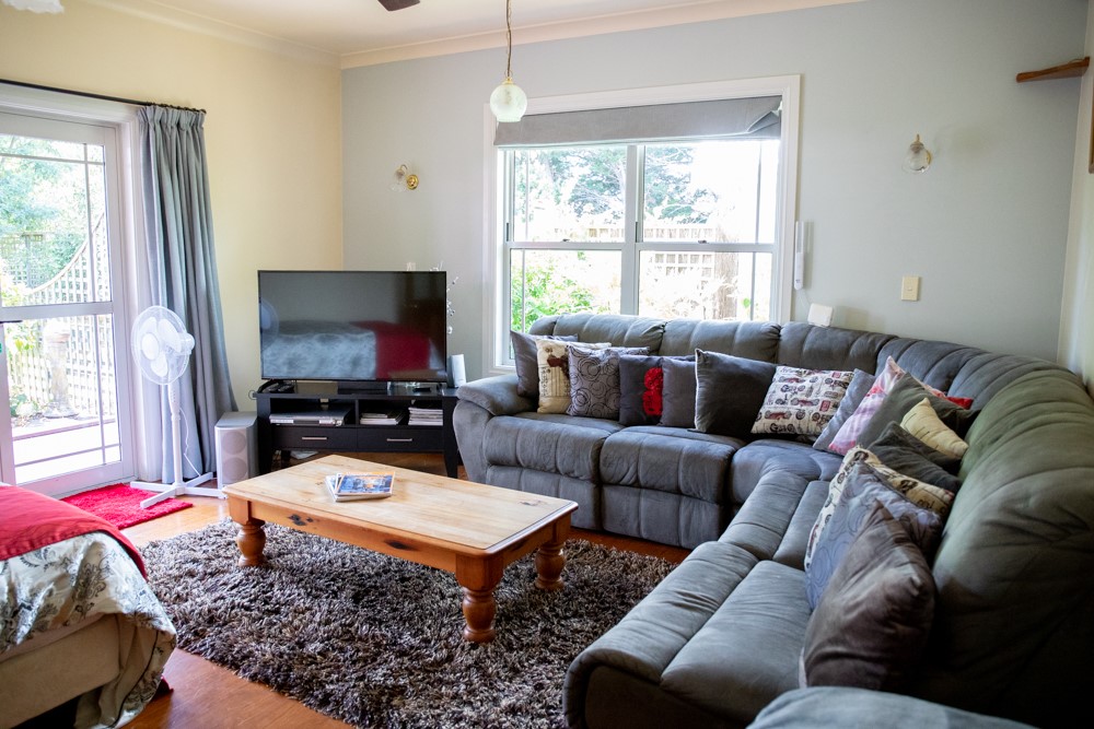 TV room with Queen bed