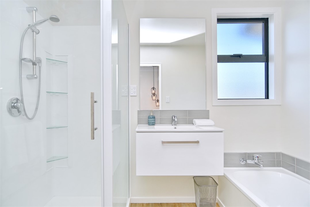 Bathroom 1 has a Shower and a bathtub