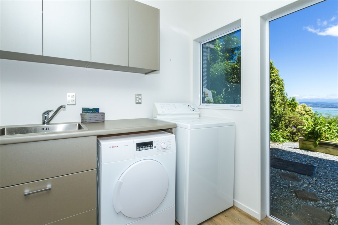 Downstairs Laundry with washing machine & dryer