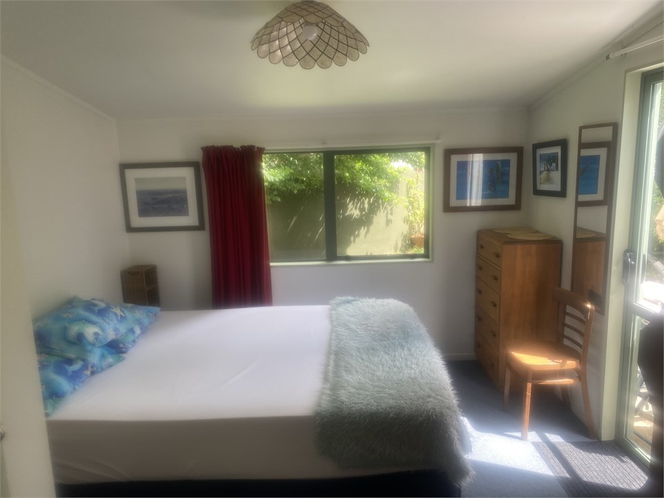 Queen bedroom window looks out to Plum tree